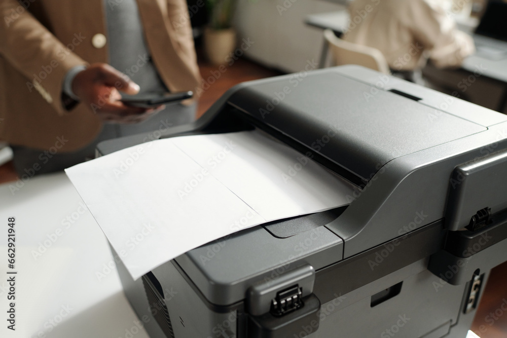 Poster plastic grey xerox machine with paper document on tray standing on workplace of office manager or ac