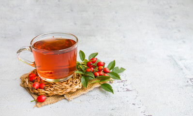 Rosehip tea on a wooden background 