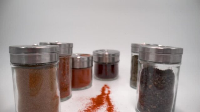 Spices in small jars close up 4K