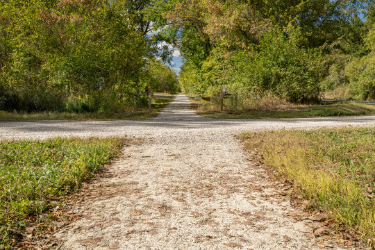Katy Trail is crossing a local dirt road near Hartsburg, Missouri, fall scenery
