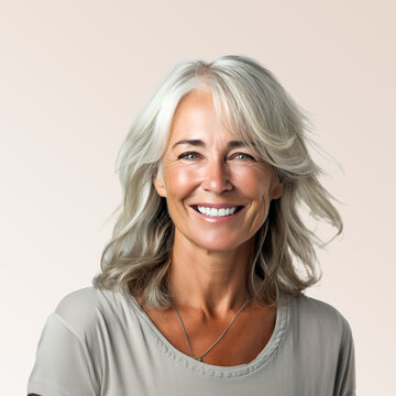 A closeup photo portrait of a beautiful senior woman American model woman smiling with bright white clean teeth, used for a dental ad, dentist advertisement, isolated on gradient background