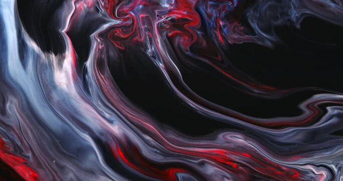 Abstract unique moving background with blue, red paint on a black substrate. Liquid art. Pastel, soft tones.