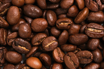 Roasted coffee beans closeup on macro photo.