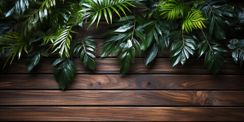 Smooth wooden surface against a background of tropical leaves.