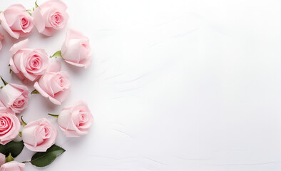 Top view of pink flowers on white table with copy space 