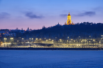Fototapeta premium Winter's Dusk Over Dnipro River and Kyiv