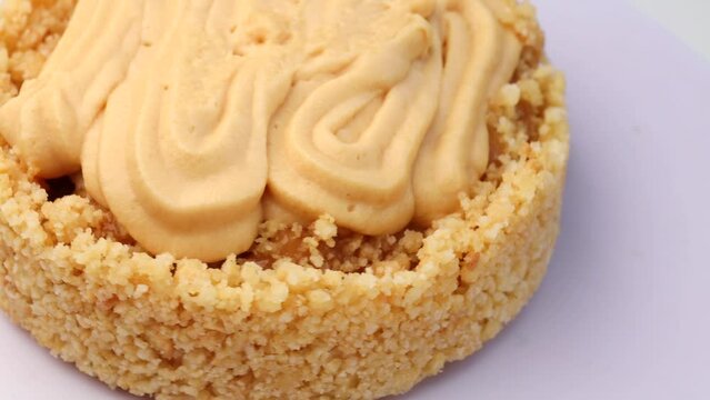 a homemade dessert banoffee pie, rotation in circle. The cake is made from cookies, Condensed Milk, banana and cream. Cake , Turning
