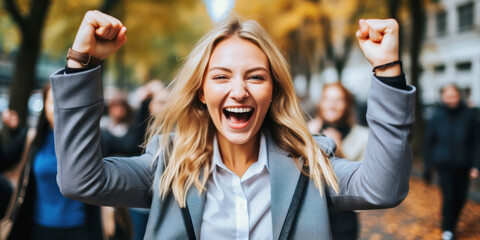 young happy woman celebrating success, winning a competition or entering a university