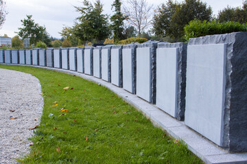 new and unmarked memorial stones at a cemetery