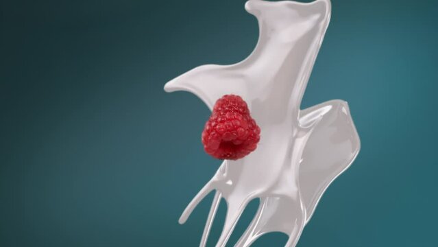 Fresh milk splash falling in slow motion with droplets and raspberry