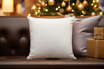 Blank white pillow mockup on black leather sofa with christmas tree and lights bokeh background. Holiday template composition with decoration. Copy space.