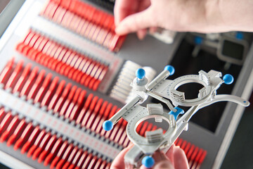 Specialist works with a special ophthalmic gadget