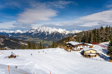 Schladming alpine ski resort with Dachstein Mountain on background, Keibling Alm area, Austria - obrazy, fototapety, plakaty