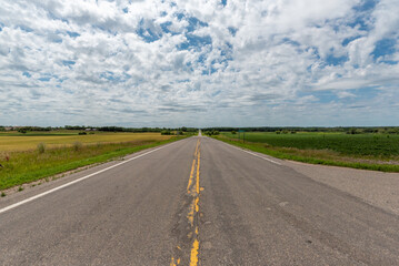 Looking down the center line of a country road in rural Minnesota, USA.
