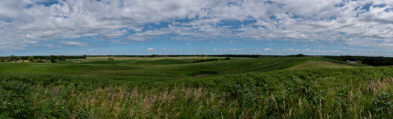 Panoramic view of the fertile countryside with different crops in the fields of rural west central Minnesota, United States.
