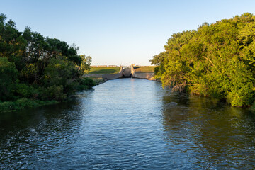 The Orwell Dam and part of the Ottertail River outside of Fergus Falls, Minnesota on a summers day
