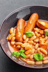cassoulet thick bean soup with meat, beans, sausages delicious healthy eating cooking appetizer meal food snack on the table copy space food background rustic top view