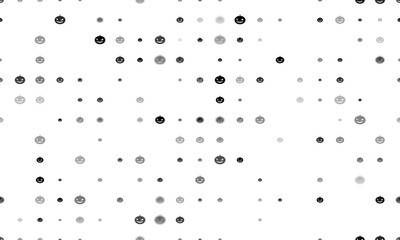 Seamless background pattern of evenly spaced black halloween pumpkin symbols of different sizes and opacity. Illustration on transparent background
