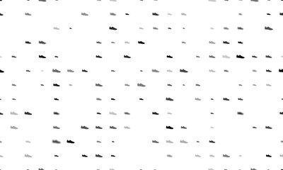 Seamless background pattern of evenly spaced black football boot symbols of different sizes and opacity. Illustration on transparent background