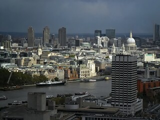 London City skyline is sunlit with grey sky