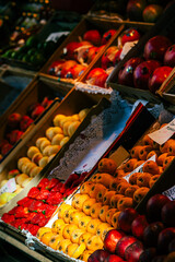 medlars, strawberries and other fruits in a fruit shop in the market