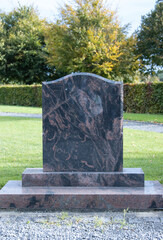 new unmarked headstones at a cemetery