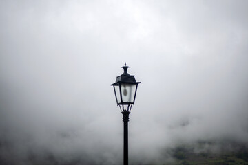 A streetlight in the middle of the fog