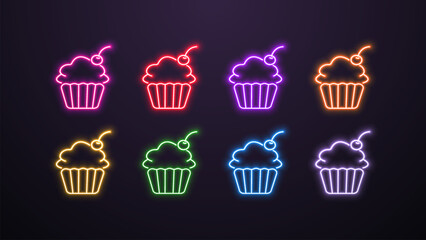 A set of neon bright shiny glowing cupcake icons with a cherry in different colors on a dark background.