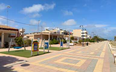 Naklejka premium Vacation pay housing at seaside. Vacation House at coast. Real Estate Penthouse apartments. Residential urbanization. Road Path at sea beach. Townhouse near beach sea. Holiday accommodation