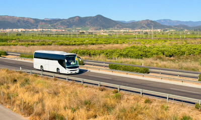 Bus on highway. Tour Bus driving on highway road. Public transport for traveling. Bus travel in Europe. Passenger bus on motorway. Transportation of passengers by public transport by road