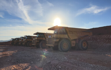 Mining truck in open-pit mining. Construction equipment on soil transport. Haul truck at construction site. Mining civil works and Earthmoving. Off highway Trucks on construction. Haul dump truck.