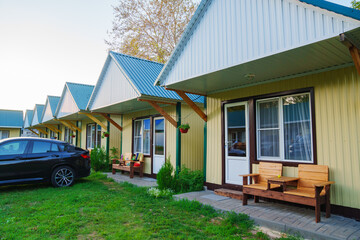 One-story motel houses. Cozy and comfortable accommodation with parking.