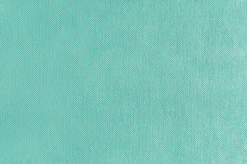 Texture background of turquoise velours fabric. Textile structure, cloth surface, weaving of...