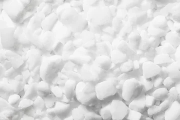 Foto op Aluminium Coarse grain salt. Dishwasher salt texture. Granulated crystalline sodium chloride. Closeup grains. White granules background. Chemistry dry additive. Granular closeup. © Paweł Michałowski