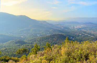 Mountains landscape, nature scenery. Sunset over mountain rock. View from Peak of La Redona mountain range in Sierra Calderona, Spain. Landscape of a mountain valley.