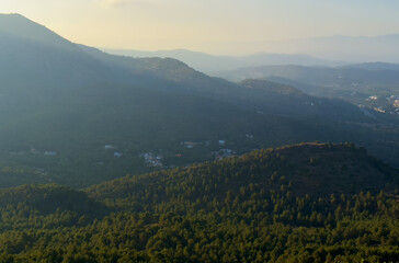 Mountains landscape, nature scenery. Sunset over mountain rock. View from Peak of La Redona mountain range in Sierra Calderona, Spain. Landscape of a mountain valley.