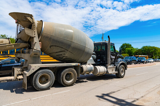Dallas, USA - April 24, 2023: Tiseo Paving company Kenworth concrete mixer truck lateral view