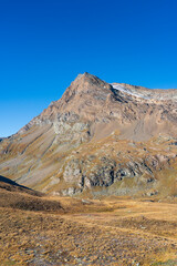 Basei rocky mountain and glacier on the top, Gran Paradiso National Park. view from Nivolet trail in autumn. blue sky (copy space) with no clouds