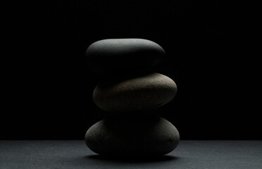 Fototapeta na wymiar three zen stones in a stack for product presentation