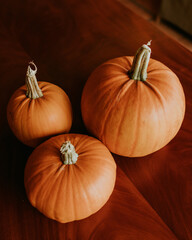 Three pumpkins on a table