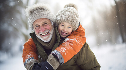 Winter portrait of grandfather and grandchild in snowy park.