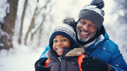 Happy african american family with father and son spending time together in winter park.