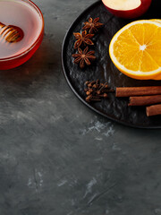 Mulled Wine Ingredients on Dark Concrete Background. Copy Space