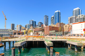 Construction cranes and work being done on the downtown Seattle Waterfront and cruise port along...