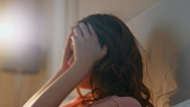 Blurred woman feeling dizzy in sunlight closeup. Upset female suffering headache