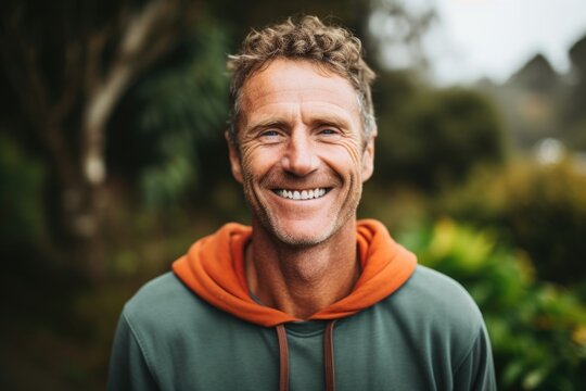 A man with a warm and friendly smile, his freckles adding to his approachable nature as he works as a the. He uses his empathetic nature and ability to connect with others to help them overcome