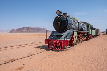 old abandoned historic locomotive in the desert near Wadi Rum