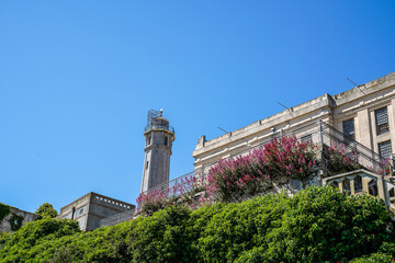 View of the outside of several building and lighthouse at the former Alcatraz Penitentiary in San...