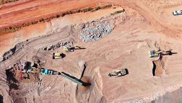 Quarry open pit mining operation crushing cone rock conveying granite