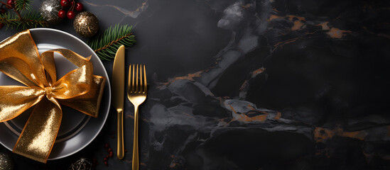A festive banner with golden cutlery on a black stone table, versatile for Christmas, New Year, or any use, with copy space for text